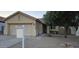 Charming single-story home with a well-maintained front yard and a two-car garage at 6722 W Shannon St, Chandler, AZ 85226