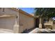 Charming single-Gathering home with desert landscaping and a tan-colored exterior and a two car garage at 6722 W Shannon St, Chandler, AZ 85226