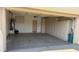 Spacious garage with ample storage solutions, including wall-mounted cabinets and storage space at 6722 W Shannon St, Chandler, AZ 85226
