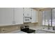 Bright kitchen featuring white cabinetry, stainless steel appliances, and natural light at 6722 W Shannon St, Chandler, AZ 85226