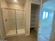 Bright bathroom featuring a glass-enclosed shower and a built-in storage at 7209 E Blissful Breeze Ln, San Tan Valley, AZ 85143