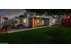 Inviting backyard featuring lush lawn, patio seating, playground and modern sauna perfect for leisure and play at 728 E State Ave, Phoenix, AZ 85020