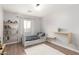 Cozy, light-filled bedroom features stylish decor, shelves, and a plush rug, creating a warm atmosphere at 728 E State Ave, Phoenix, AZ 85020