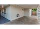 Covered carport featuring storage cabinets and access to the backyard at 728 E State Ave, Phoenix, AZ 85020
