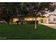 Inviting front exterior featuring well-maintained landscaping, mature trees, and a cozy, suburban aesthetic at 728 E State Ave, Phoenix, AZ 85020
