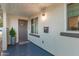 Welcoming front porch with a stylish front door, sleek mailbox, and a charming potted plant, offering a warm entrance at 728 E State Ave, Phoenix, AZ 85020