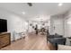 Open floor plan connecting living and dining areas, showcasing stylish wood-style floors and modern design elements at 728 E State Ave, Phoenix, AZ 85020