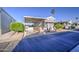 Charming mobile home showcasing a carport, front porch with stairs, and beautiful landscaping at 7750 E Broadway Rd # 361, Mesa, AZ 85208
