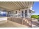 Exterior view of a well-maintained home with a covered porch and railings at 7750 E Broadway Rd # 361, Mesa, AZ 85208
