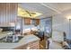 Spacious kitchen featuring ample cabinet space, modern appliances, and a dining area at 7750 E Broadway Rd # 361, Mesa, AZ 85208