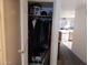 Coat closet with various jackets and items on the floor offering practical storage as a point of entry at 8651 E Royal Palm Rd # 118, Scottsdale, AZ 85258