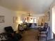 Spacious open living area featuring a dining table and view of the kitchen at 8651 E Royal Palm Rd # 118, Scottsdale, AZ 85258