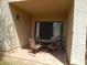 Covered outdoor patio featuring a table and chairs on a tiled surface at 8651 E Royal Palm Rd # 118, Scottsdale, AZ 85258
