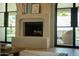 Modern fireplace with a clean design, providing a focal point in the living area at 8910 E Topeka Dr, Scottsdale, AZ 85255