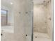 Bright bathroom featuring a soaking tub and walk-in shower with elegant tile work and classic fixtures at 9203 S Heather Dr, Tempe, AZ 85284