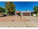 Charming single-story home featuring mature trees, desert landscaping, and a two-car garage at 9203 S Heather Dr, Tempe, AZ 85284
