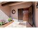 Inviting front entrance featuring a decorative door, tiled walkway, and an attractive planter at 9203 S Heather Dr, Tempe, AZ 85284
