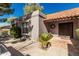 Close up of front door and entryway featuring a tile roof and desert landscaping at 9203 S Heather Dr, Tempe, AZ 85284