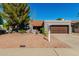Charming single-story home featuring desert landscaping, a tile roof and attached two-car garage at 9203 S Heather Dr, Tempe, AZ 85284