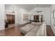 Inviting living room features a comfortable sectional sofa, a striking front door, and an open dining area at 9203 S Heather Dr, Tempe, AZ 85284
