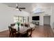 Open concept living and dining room with vaulted ceilings and large windows at 9203 S Heather Dr, Tempe, AZ 85284
