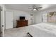 Spacious main bedroom with gray carpet, white walls, and access to the backyard patio at 9203 S Heather Dr, Tempe, AZ 85284