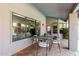 Covered patio with tile flooring and an outdoor dining area, perfect for entertaining at 9203 S Heather Dr, Tempe, AZ 85284
