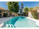 Inviting swimming pool with blue and white tile and lush landscaping at 9203 S Heather Dr, Tempe, AZ 85284