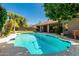 Sparkling backyard pool with patio area and manicured landscaping. Perfect for relaxing and enjoying outdoors! at 9203 S Heather Dr, Tempe, AZ 85284