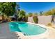 Sparkling in-ground swimming pool with well-maintained landscaping and privacy fence at 9203 S Heather Dr, Tempe, AZ 85284