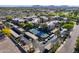 Aerial view showcasing community tennis court, well-manicured landscaping, and ample parking at 9451 E Becker Ln # 2016, Scottsdale, AZ 85260