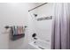 Clean bathroom with a shower/tub combo featuring stylish tile accents and white shower curtain at 9451 E Becker Ln # 2016, Scottsdale, AZ 85260