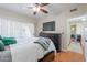 Cozy bedroom with a large bed, TV, and a view of the fireplace at 9451 E Becker Ln # 2016, Scottsdale, AZ 85260
