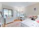Bright bedroom with white furniture, vanity, and a window for natural light at 9451 E Becker Ln # 2016, Scottsdale, AZ 85260
