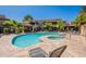 A refreshing community pool with spa, surrounded by lush landscaping and seating at 9451 E Becker Ln # 2016, Scottsdale, AZ 85260
