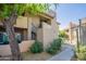Exterior featuring desert landscaping and stairs to the second level units at 9451 E Becker Ln # 2016, Scottsdale, AZ 85260