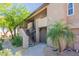Condo exterior featuring desert landscaping and stairs to the second level at 9451 E Becker Ln # 2016, Scottsdale, AZ 85260