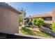 Exterior view showcasing a well-maintained lawn and building exteriors at 9451 E Becker Ln # 2016, Scottsdale, AZ 85260