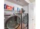 LG washer and dryer with supplies on shelves; a convenient laundry room at 9451 E Becker Ln # 2016, Scottsdale, AZ 85260