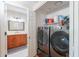 A functional laundry room with a washer, dryer and storage, adjacent to bathroom at 9451 E Becker Ln # 2016, Scottsdale, AZ 85260