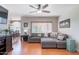 Bright open concept living room features a sectional sofa and wood-look flooring at 9451 E Becker Ln # 2016, Scottsdale, AZ 85260