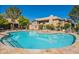 Sparkling community pool with lounge chairs and meticulously maintained landscaping at 9451 E Becker Ln # 2016, Scottsdale, AZ 85260