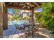 Charming outdoor seating area with views of the pristine community pool and lush greenery at 9451 E Becker Ln # 2016, Scottsdale, AZ 85260
