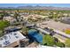 Aerial view of a community tennis court with covered parking and desert landscaping at 9451 E Becker Ln # 2016, Scottsdale, AZ 85260