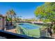 Aerial view of a community tennis court surrounded by lush greenery and blue skies at 9451 E Becker Ln # 2016, Scottsdale, AZ 85260