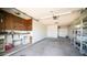 Organized garage space offers ample storage shelves and workspace area at 9911 W Pleasant Valley Rd, Sun City, AZ 85351
