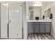 Bathroom featuring a glass shower, modern vanity, and updated fixtures for a luxurious experience at 10311 E Trent Ave, Mesa, AZ 85212