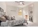 This is a bright bedroom featuring a window, neutral walls and an ensuite bath at 10311 E Trent Ave, Mesa, AZ 85212