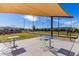 Outdoor bocce ball court with seating and shade at 10311 E Trent Ave, Mesa, AZ 85212