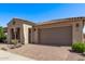 A well-maintained home showcasing a tiled roof, a spacious driveway, and mature landscaping, perfect for suburban living at 10311 E Trent Ave, Mesa, AZ 85212